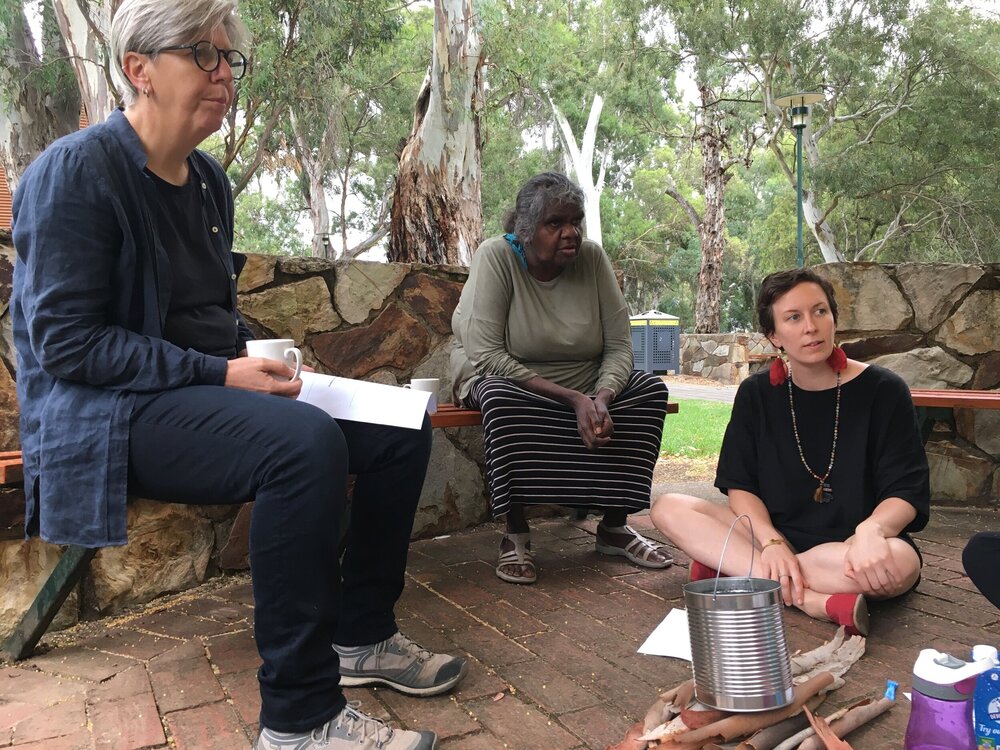 Tutor Murika (centre) running through a role play scene with attendees Nerida and Laura.